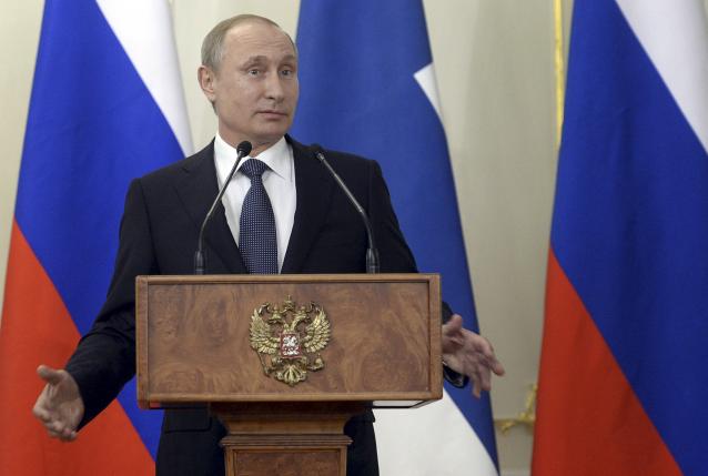 Putin warns NATO, Russia beefing up 'saber-rattling'