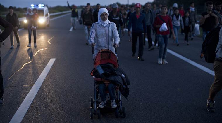 Hundreds of migrants surge past police near Hungary border